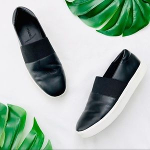Vince black leather slip on sneakers